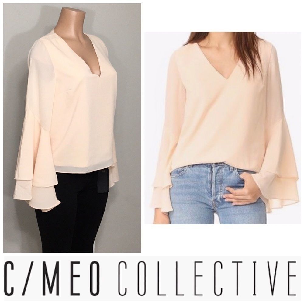 V-neck bell sleeved blouse. NWOT